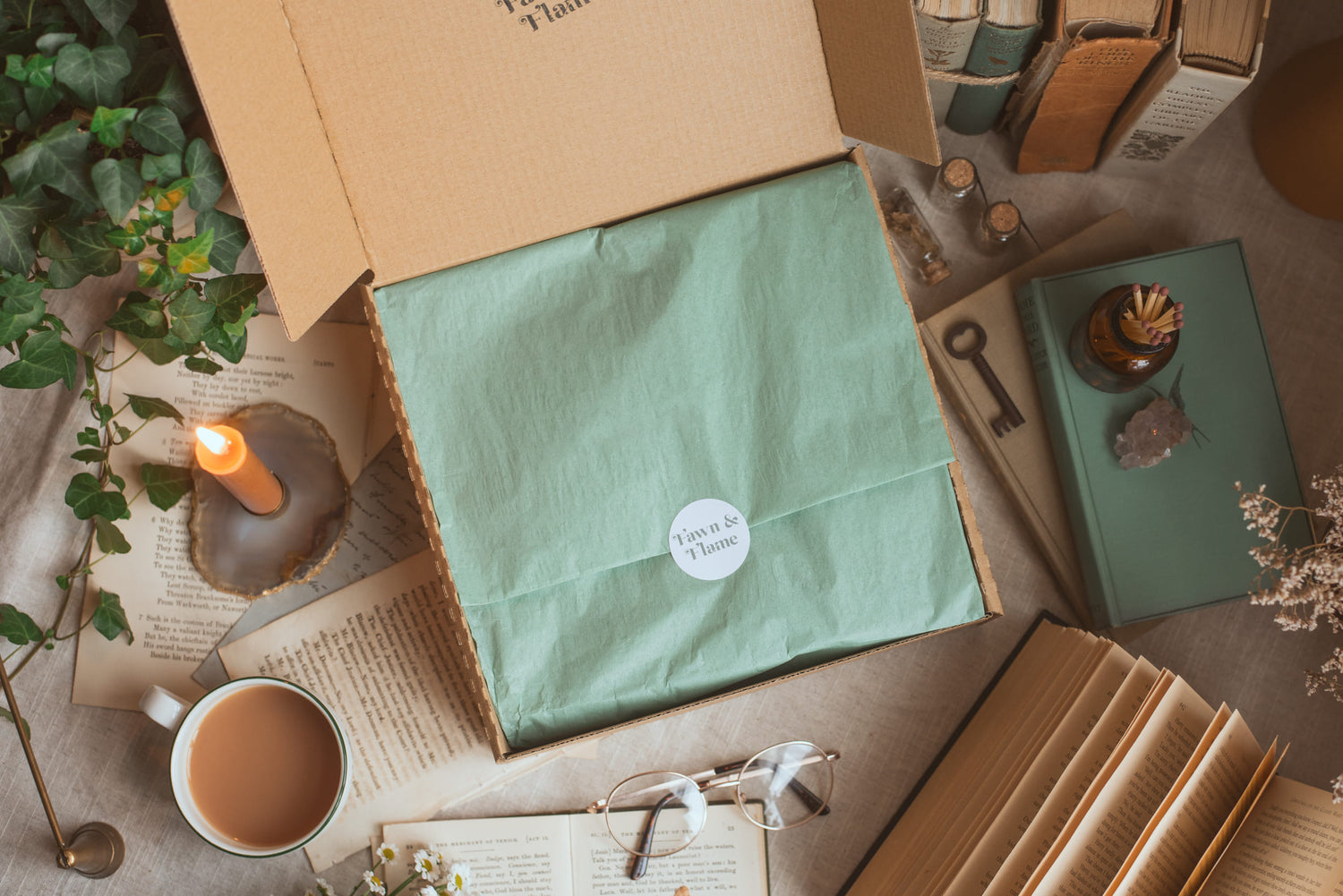 Fawn and Flame’s seasonal reading ritual subscription box with books and candles.